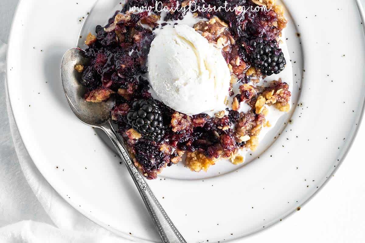 Close Up Top View of Blackberry Crumble with Vanilla Ice Cream 